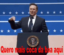 a man stands at a podium with the words quero mais coca da boa aqui