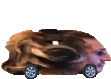 a picture of a man 's head in a car with wheels .