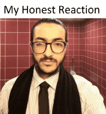 a man wearing glasses and a scarf with the words " my honest reaction " below him