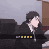 a man in a suit and tie is sitting at a desk with a snapchat of him saying son