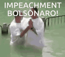 two men are being baptized in the water and the caption says impeachment bolsonaro !