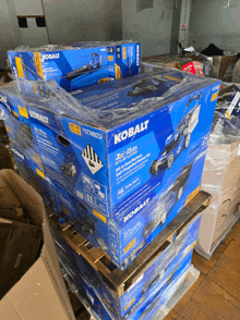 boxes of kobalt products are stacked on top of each other on pallets