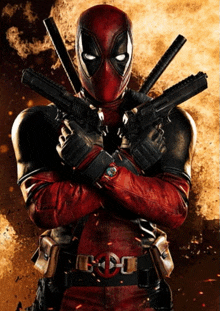 a man in a deadpool costume is holding a gun