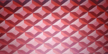 a pink and red geometric pattern on a white surface