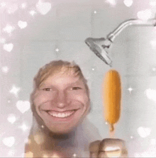 a man is taking a shower while holding an ice cream bar