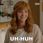 a woman with red hair says uh-huh in white
