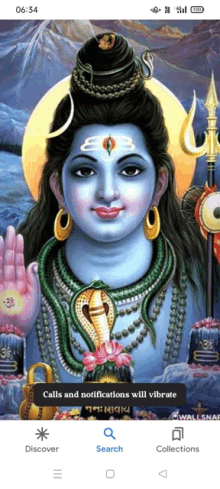 a phone screen shows a painting of a deity called shiva