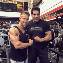 two men are posing for a picture in a gym and one has a shirt that says ferrigno legacy