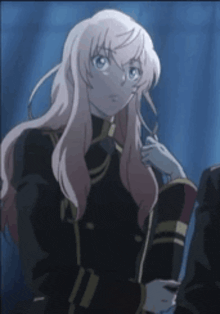 a girl with long pink hair is standing in front of a blue curtain
