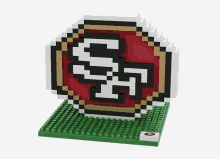 a lego model of the san francisco 49ers logo on a green base