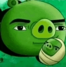 a green angry birds character is holding a baby pig in its mouth .