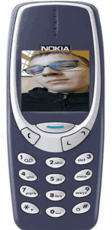 a blue nokia phone with a picture of a man on the screen