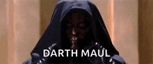 darth maul from star wars is wearing a black hooded jacket .