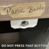 a piece of paper with the words panic button written on it .