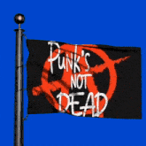a black and red flag that says punk 's not dead on it