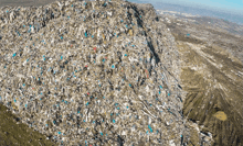 a large pile of garbage on top of a hill