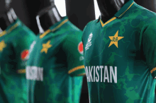 three green shirts with the word pakistan on them