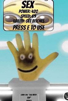 a statue of a hand with a smiley face on it is sitting on top of a podium .