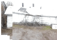 a black and white photo of a house with a sign that says rl on it