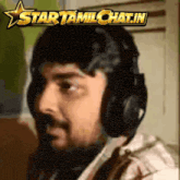 a man wearing headphones with a star behind him that says startamlchat.in