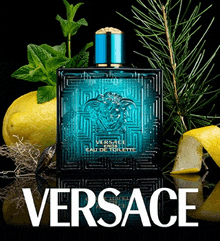 a bottle of versace eros eau de toilette surrounded by lemons and mint leaves