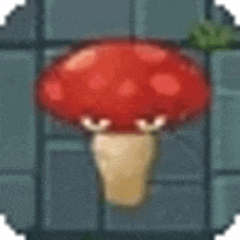 a red mushroom with white spots on it is sitting on a brick wall .