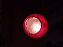 a red candle with a white candle in it