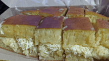 a close up of a slice of cake with cheese on top