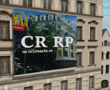 a large billboard on the side of a building that says cr rp on it