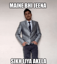 a man in a suit and tie is standing with his hands in his pockets and the caption maine bhi jeena