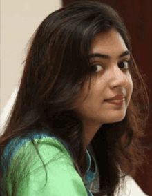 a close up of a woman 's face with long hair