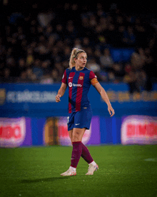 a female soccer player wearing a spotify jersey