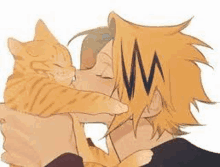 a man is holding an orange cat in his arms and kissing it .