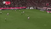 a man wearing a red and white t-mobile jersey is running on a soccer field