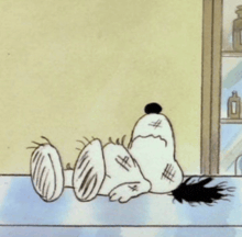 a cartoon of snoopy laying on a table with a bottle in the background