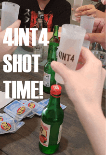 a group of people toasting with shot glasses that say 4in14 shot time