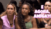 a group of women sitting next to each other with e agora amiga written on the top
