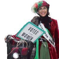 a woman wearing a sash that says vote for women