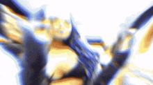 a blurry picture of a person 's face with a blue and yellow background