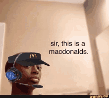 a man wearing a mcdonald 's hat and headphones says sir this is a macdonalds .