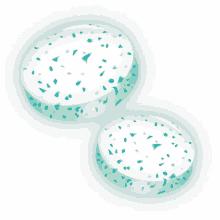 two pieces of gum with blue sprinkles on a white background