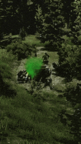 a group of soldiers in a video game with a green glowing object behind them