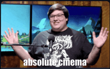 a man stands in front of a microphone with the words absolute cinema below him