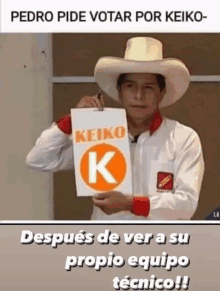 a man in a cowboy hat is holding up a sign that says keiko k