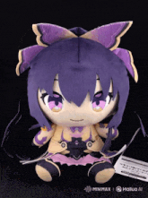 a stuffed doll with purple hair and a tag that says minimax on it