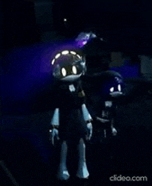 two robots are standing next to each other in a dark room .