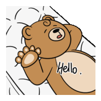 a brown teddy bear laying on a bed with the words hello written on it