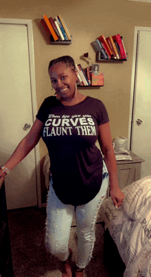 a woman wearing a t-shirt that says " curves flaunt them "