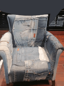 a chair made out of denim pants and shirts