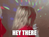 a pixelated image of a woman dancing with the words " hey there " above her